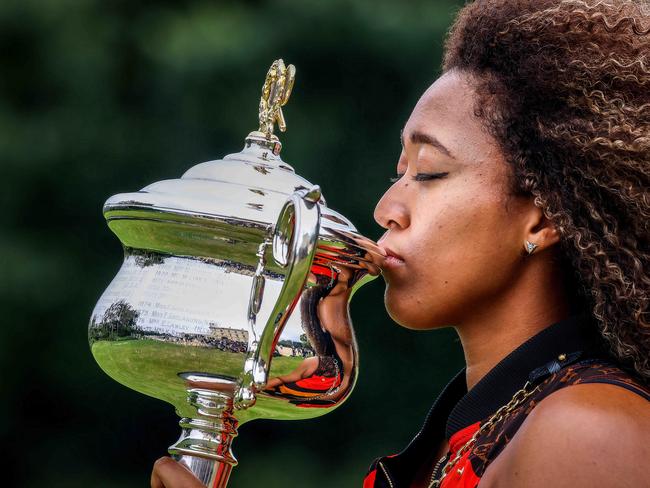 MELBOURNE , AUSTRALIA - NewsWire Photos FEBRUARY 21, 2021 : Australian Open 2021 WomenÃs Champion Naomi Osaka celebrates her win with the trophybeing her fourth Grand Slam title  at Government House, Melbourne. Picture : NCA NewsWire  /  Ian Currie