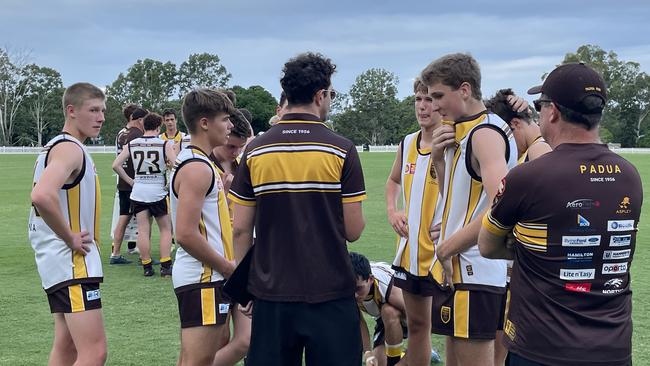 Coach Giuliano instructing the Padua boys during the half time huddle.