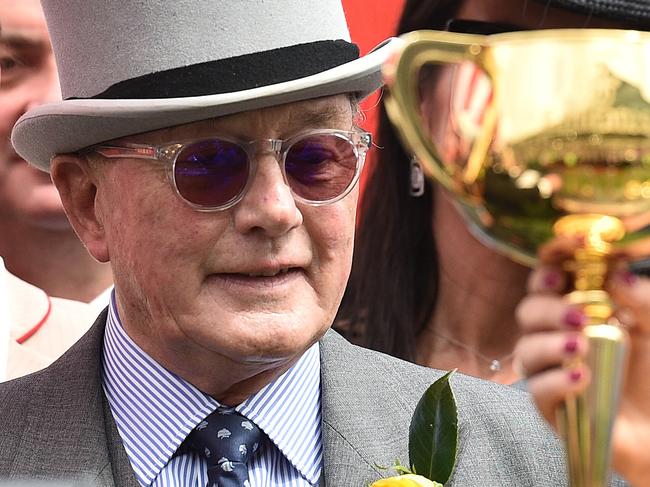 Lloyd Williams is seen alongside the Melbourne Cup after Almandin won the race at Flemington Racecourse in Melbourne, Tuesday. Nov. 1, 2016. (AAP Image/Julian Smith) NO ARCHIVING, EDITORIAL USE ONLY