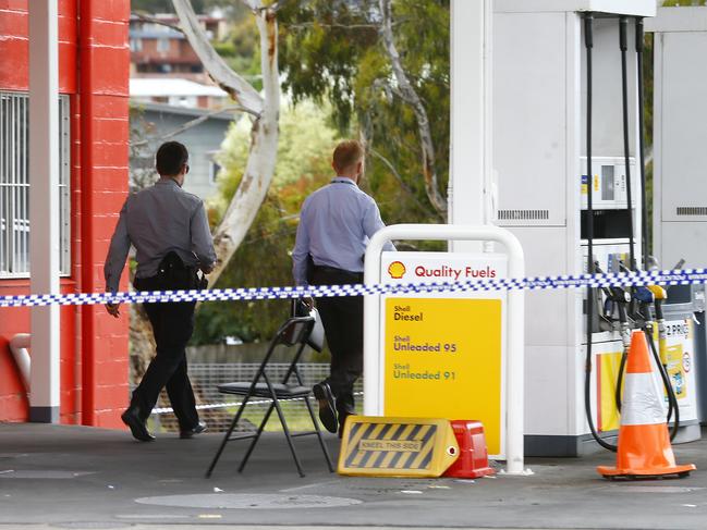 Police at the scene of the fatal stabbing at the Blackmans Bay Coles Express petrol station. Picture: MATT THOMPSON