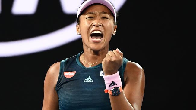 Naomi Osaka celebrates a point win during her Australian Open final victory.