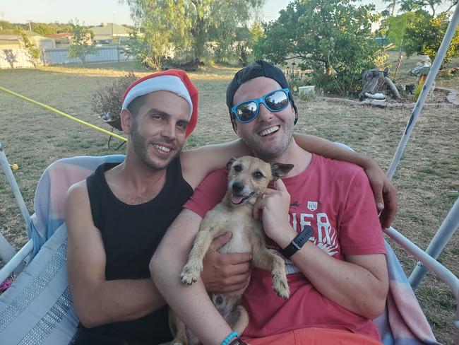 Jason Whatnall (left) with his partner Nick and Milo. Photo: supplied.