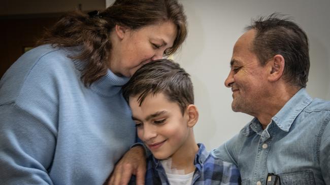 David Maikan with his mother and father, Ksenia and Oleh, at Kyiv City Heart Center. Picture: Justyna Mielnikiewicz/MAPS for The Wall Street Journal