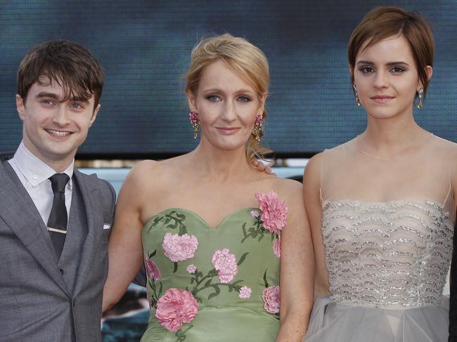 British author JK Rowling, second left, joins actors, left to right, Daniel Radcliffe, Emma Watson and Rupert Grint in Trafalgar Square, central London, for the World Premiere of 'Harry Potter and the Deathly Hallows: Part 2' the last film in the series, Thursday, July 7, 2011. Harry Potter's saga is ending, but his magic spell remains. Thousands of fans from around the world massed in London Thursday for the premiere of the final film in the magical adventure series. (AP Photo/Joel Ryan)