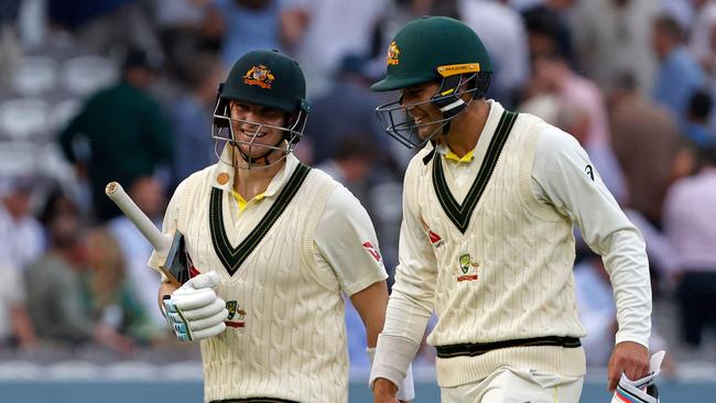 Australia's Steve Smith (L) has verified that Alex Carey wasn’t at the barber. Picture: Getty