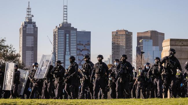 Police during the protests in Melbourne. Picture: Jason Edwards