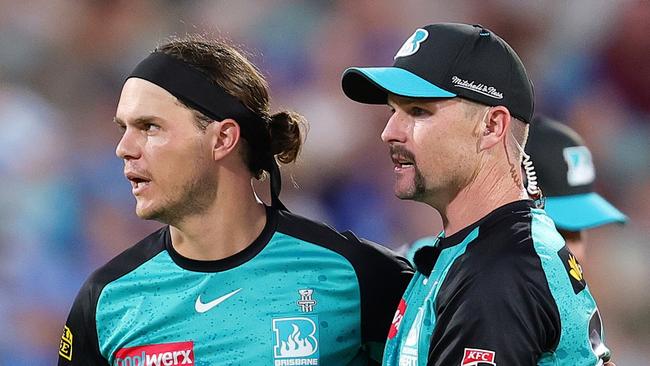 ADELAIDE, AUSTRALIA - JANUARY 11: Mitch Swepson of the Heat celebrates the bowling wicket of Jamie Overton of the Strikers for 6 runs with Colin Munro of the Heat during the BBL match between Adelaide Strikers and Brisbane Heat at Adelaide Oval, on January 11, 2025, in Adelaide, Australia. (Photo by Sarah Reed/Getty Images)