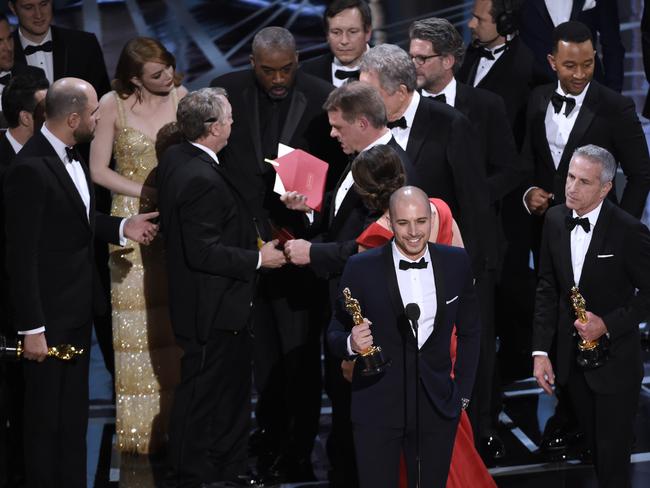 Mayhem ensues behind Fred Berger, producer of La La Land, as he gave an acceptance speech for the award that never was at this week’s Oscars. Picture: AP