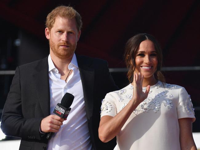 Meghan wore a white shift dress for her concert appearance. Picture: AFP