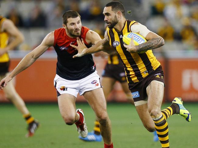 Shaun Burgoyne tries to fend off Colin Garland. Pic: Michael Klein.