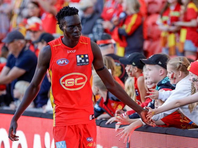 Mac Andrew of the Suns interacts with fans during the 2024 AFL Round 18 match between the Gold Coast Suns and Port Adelaide Power. Picture: Russell Freeman/AFL Photos via Getty Images.