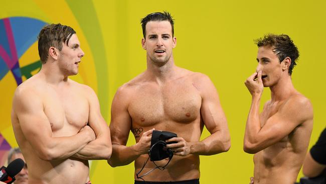 Kyle Chalmers, James Magnussen and Cameron McEvoy of Australia catch their breath after competing in the 4 x 100 metre Freestyle Relay during the 2016 Australian Swimming Championships.