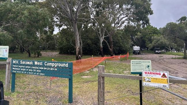 Wildlife officers erected signs around camping grounds at Inskip Point after a crocodile was spotted at the beach.