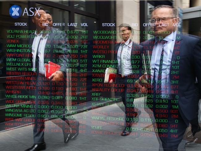 SYDNEY, AUSTRALIA - Newswire Photos -November 14, 2022 A general view of members of the public walking past the digital boards at the ASX in Sydney. Picture: NCA Newswire / Gaye Gerard