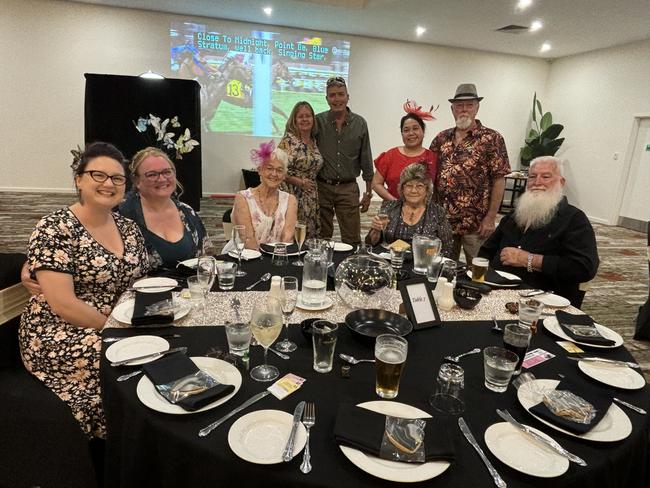 A group enjoying the fun of the Melbourne Cup at the Carriers Arms Hotel.