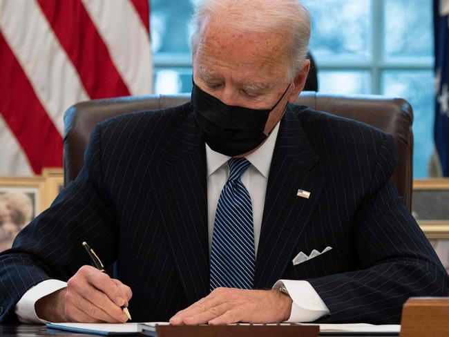 US President Joe Biden signs an Executive Order reversing a Trump era ban on Transgender serving in the military. Picture: AFP