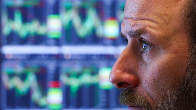 Traders work on the floor of the New York Stock Exchange (NYSE) at the opening bell on March 7, 2025, in New York City. Wall Street stocks rose early March 7, digesting a mixed jobs report as markets seek a pivot from a rough period amid tariff uncertainty. The US added 151,000 jobs last month, up from January's revised 125,000 figure, but fewer than analysts estimates as unemployment ticked higher. (Photo by CHARLY TRIBALLEAU / AFP)