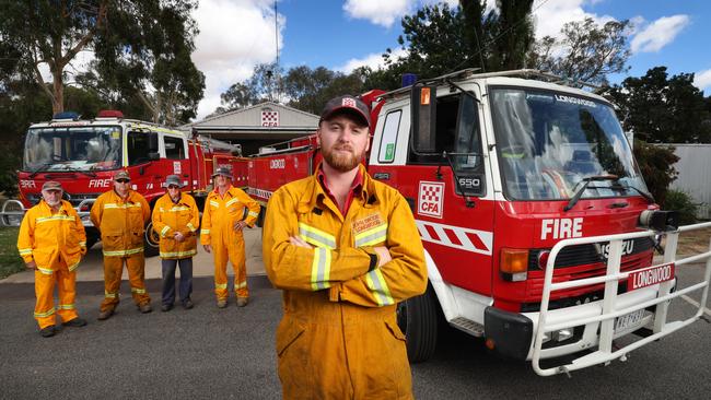 Longwood CFA volunteer John Brodie Jnr with fire fighters Paul Redfern, Jason Sloan, John Brodie Snr and Neil Tubb. Picture: David Caird