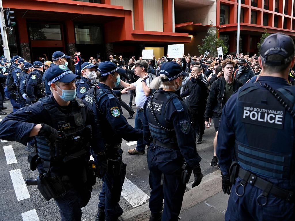 NSW Police Officers and Riot Squad officers try to disperse protestors in the CBD during a protest to rally for freedom of speech, movement, choice, assembly, and Health in Sydney. Picture: NCA NewsWire/Bianca De Marchi