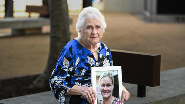 Delphine Daniels, the mother of Michelle Wolff, is photographed with a framed photo of Michelle after leaving the Supreme Court in Brisbane. Picture: NCA NewsWire