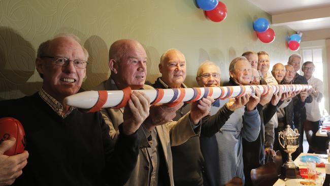 In the 1967 football state final, North Hobart's Dickie Collins was lined up to kick the winning goal when Wynyard fans stormed the pitch and stole the goal post. The 1967 team are lined up at their 50 year reunion. Picture: MATHEW FARRELL