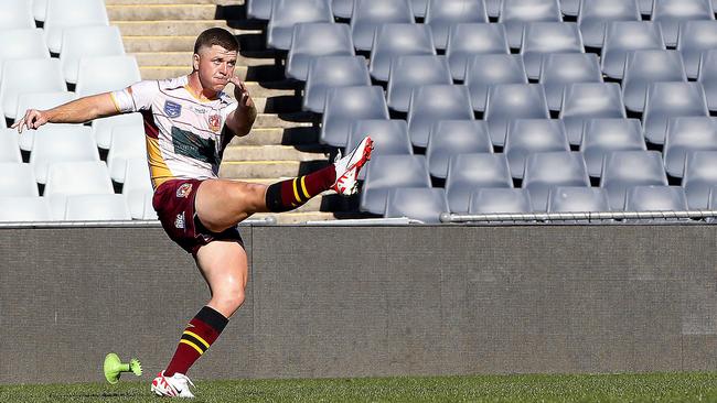 Thirlmere's Damon New kicks for goal. Picture: John Appleyard