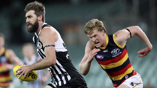 Port Adelaide’s Justin Westhoff sprints away from Adelaide’s Fischer McAsey during the Power’s win in Showdown 48. Picture: Sarah Reed