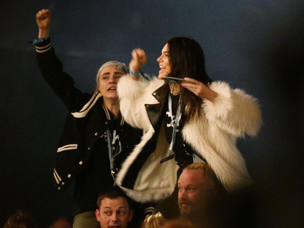 Kendall Jenner and Cara Delevingne watching Kanye West performing on the Pyramid Stage at the 2015 Glastonbury Festival. Picture: AAP