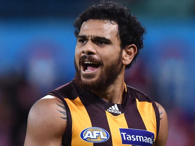 Cyril Rioli of the Hawks celebrates kicking the winning goal during the round 17 AFL match between the Sydney Swans and the Hawthorn Hawks at the Sydney Cricket Ground in Sydney on Thursday, July 14, 2016. (AAP Image/Paul Miller) NO ARCHIVING, EDITORIAL USE ONLY