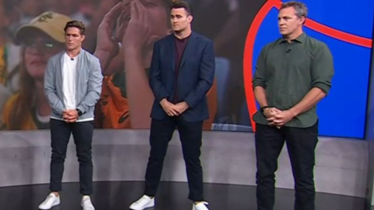 Could it be any more awkward? Michael Hooper (left) looks down while his absence from the Wallabies squad is discussed by James Horwill (centre) and Stephen Hoiles on Stan Sport.