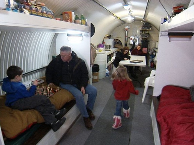 A family in their bunker in a scene from the Doomsday Preppers TV show.