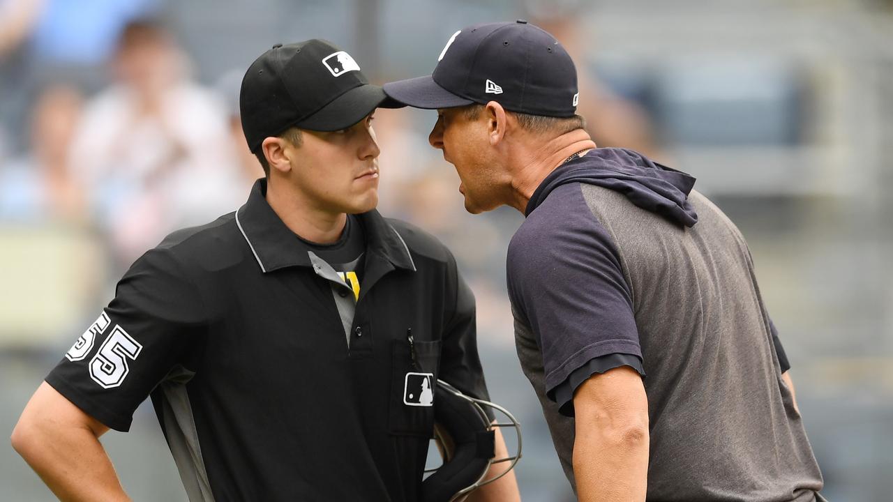 Aaron Boone gets right in the face of the home plate umpire.