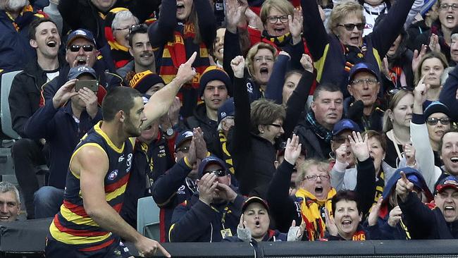 04/08/18 - AFL - Showdown 45 - Adelaide Crows v Port Adelaide at Adelaide Oval. Crows fans celebrate a Taylor Walker goal.  Picture SARAH REED