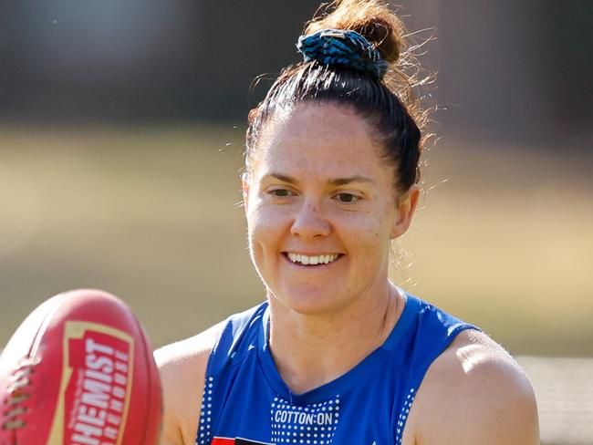 MELBOURNE, AUSTRALIA - NOVEMBER 22: Emma Kearney, Captain of the Kangaroos in seen with Jenna Bruton of the Kangaroos during a North Melbourne Kangaroos training session at Arden Street Oval on November 22, 2024 in Melbourne, Australia. (Photo by Dylan Burns/AFL Photos via Getty Images)