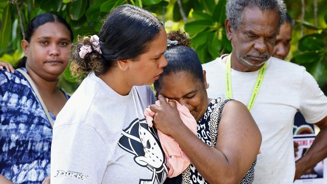 Yarrabah woman Kamaree Major is comforted by relatives Breannen Sands, Paige Fourmile and Eric Sands as she sheds tears for her missing son Markiah Major, 17, who was last seen in Cairns on August 15. Picture: Brendan Radke