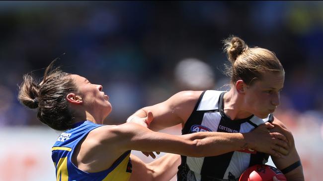 Jaimee Lambert tries to push off a tackler.