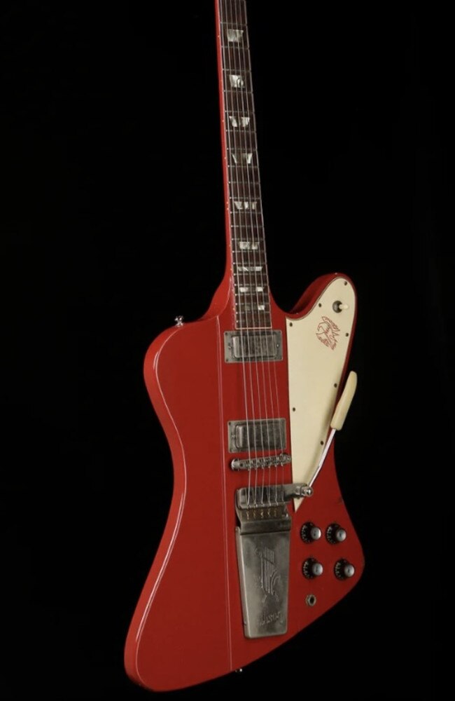 A 1964 Gibson Firebird V ‘Ember Red’ guitar owned by Guy Pearce is for sale via The Acoustic Centre in South Melbourne. Picture: The Acoustic Centre.