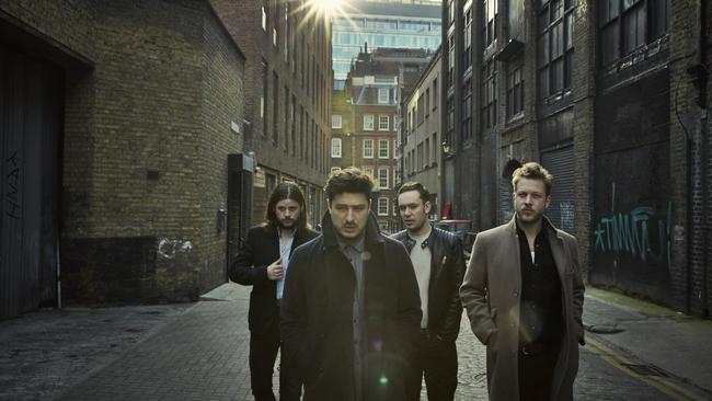 Marshall, left, with folk rock band Mumford and Sons.