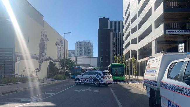 Emergency crews are on the scene after a man fell from an unknown height from a building in Townsville's CBD.