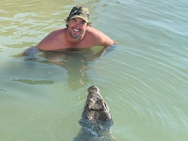 Crocodile Wrangler Matt Wright jumped in the waters by his Tiwi Island Retreat  last week to swim with resident croc Claudia. Picture: Matt Wright