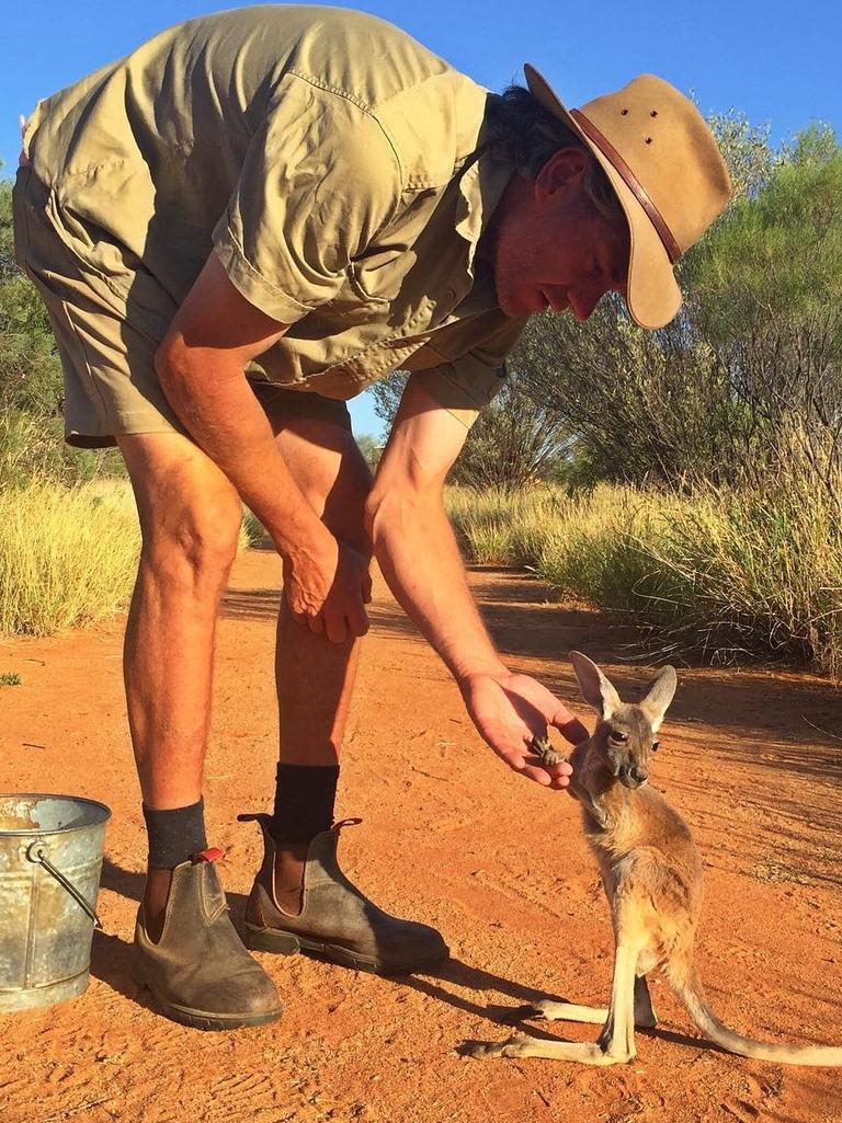 Jimmy holding hands with his mum Brolga. Picture: <a href="https://www.instagram.com/thekangaroosanctuary/" target="_blank">@thekangaroosanctuary/Instagram</a>