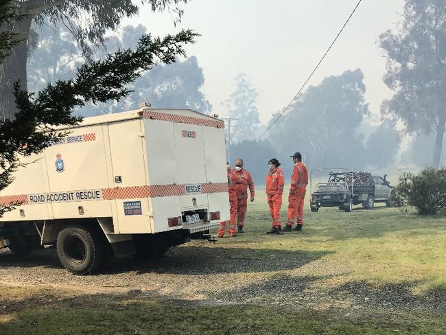 Fire and SES monitor an out of control bushfire at the top of Medeas Cove Road, St Helens.