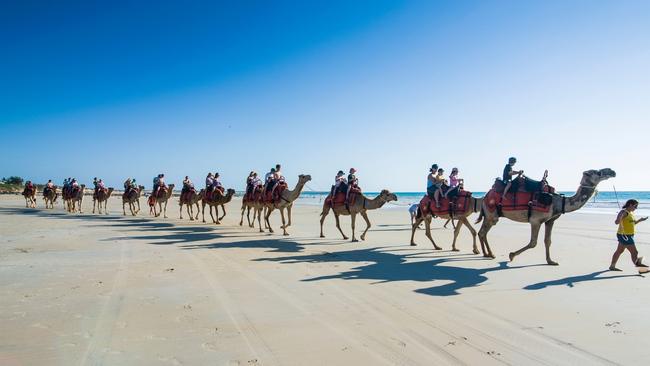 Tourists riding on camels on Cable Beach at Broome. WA tourist officials say the destination was booked solid before it was added to the half-price airfares list. Picture: Supplied