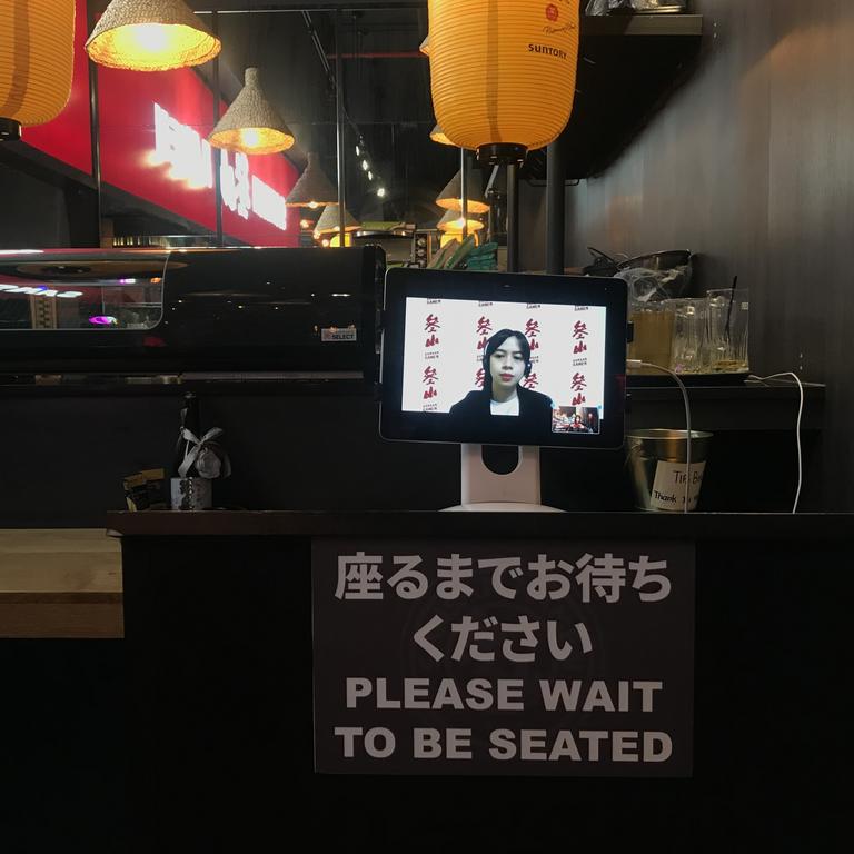 A hostess based in the Philippines appears on the screen and greets customers as they arrive at Sansan Ramen. Picture: Marie Pohl/NY Post