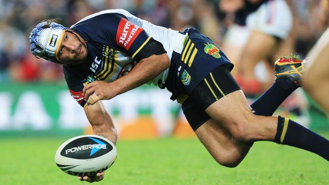 Johnathan Thurston offloads. Picture: Mark Evans