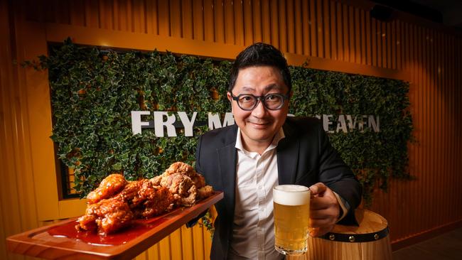 Jun Lee, co-founder of Gami Chicken &amp; Beer, with a platter of Korean fried chicken. Picture: Nicole Cleary