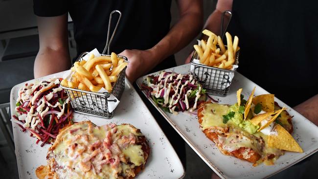 Beach Bar and Grill Mooloolaba voted best chicken parmigiana. Pictured: venue manager Reese Krause and chef Paulo Piacezzi. Photo: Patrick Woods.