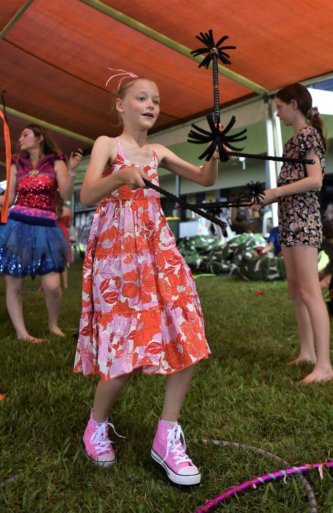 Willa Chadbourne, 9, shows off her circus skills at the Chief Minister's Cup Day at the Darwin Turf Club on Saturday, July 15.