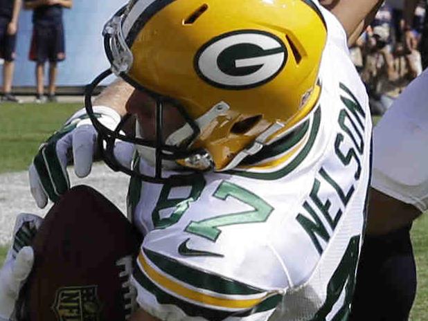 Green Bay Packers wide receiver Jordy Nelson (87) makes a touchdown reception against Chicago Bears cornerback Kyle Fuller (23) in the first half of an NFL football game Sunday, Sept. 28, 2014, in Chicago. (AP Photo/Nam Y. Huh)