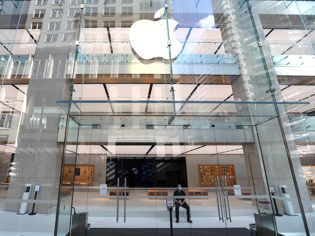 A security guard sits in front of the Apple store on George Street in Sydney’s CBD during a Covid-19 lockdown. Picture: Damian Shaw